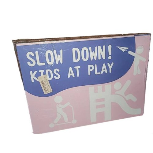 Slow down ! Kids at play . Pink sign