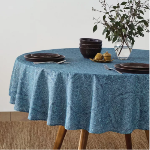 Bee & Willow™ Etched 70-Inch Round Laminated Tablecloth in Chambray